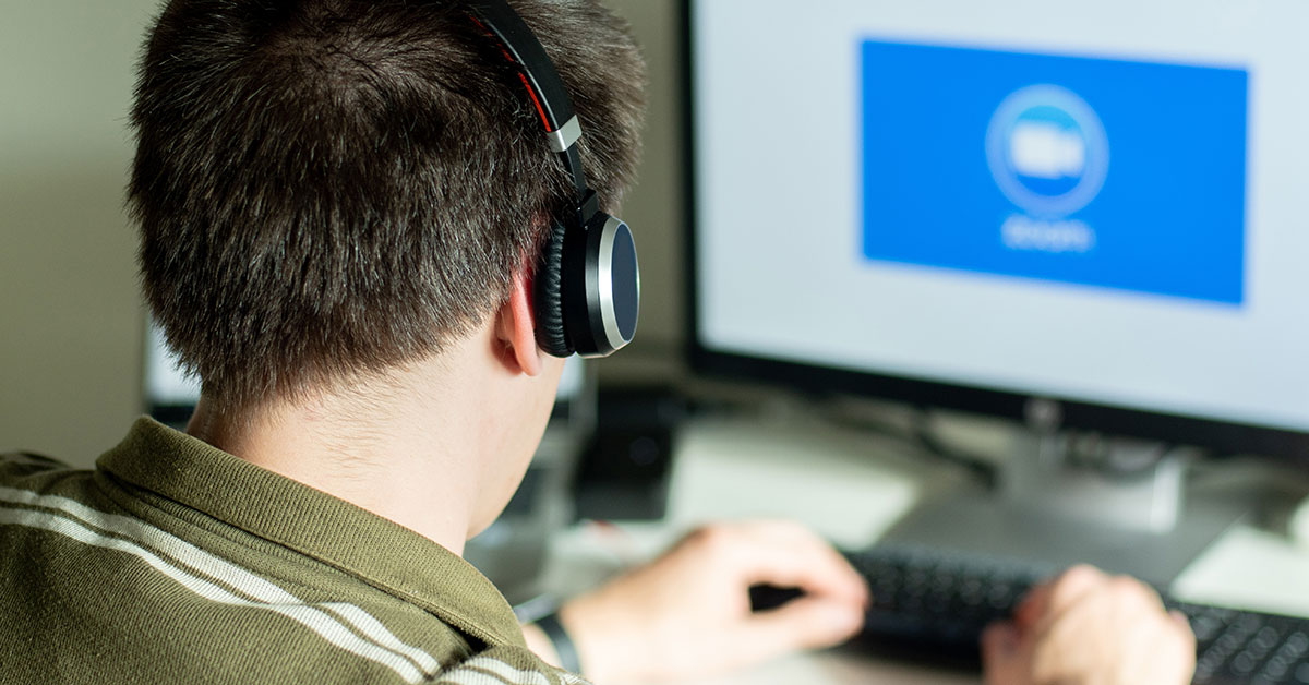 man-with-headphones-looking-on-the-monitor-with-zo-2022-11-15-14-04-04-utc